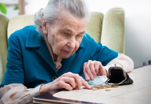 elderly woman counting change