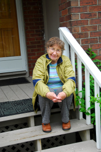 A woman wearing a yellow jacket.