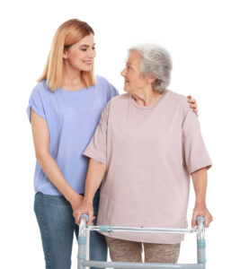 A Woman Helping an Elderly Woman to Walk